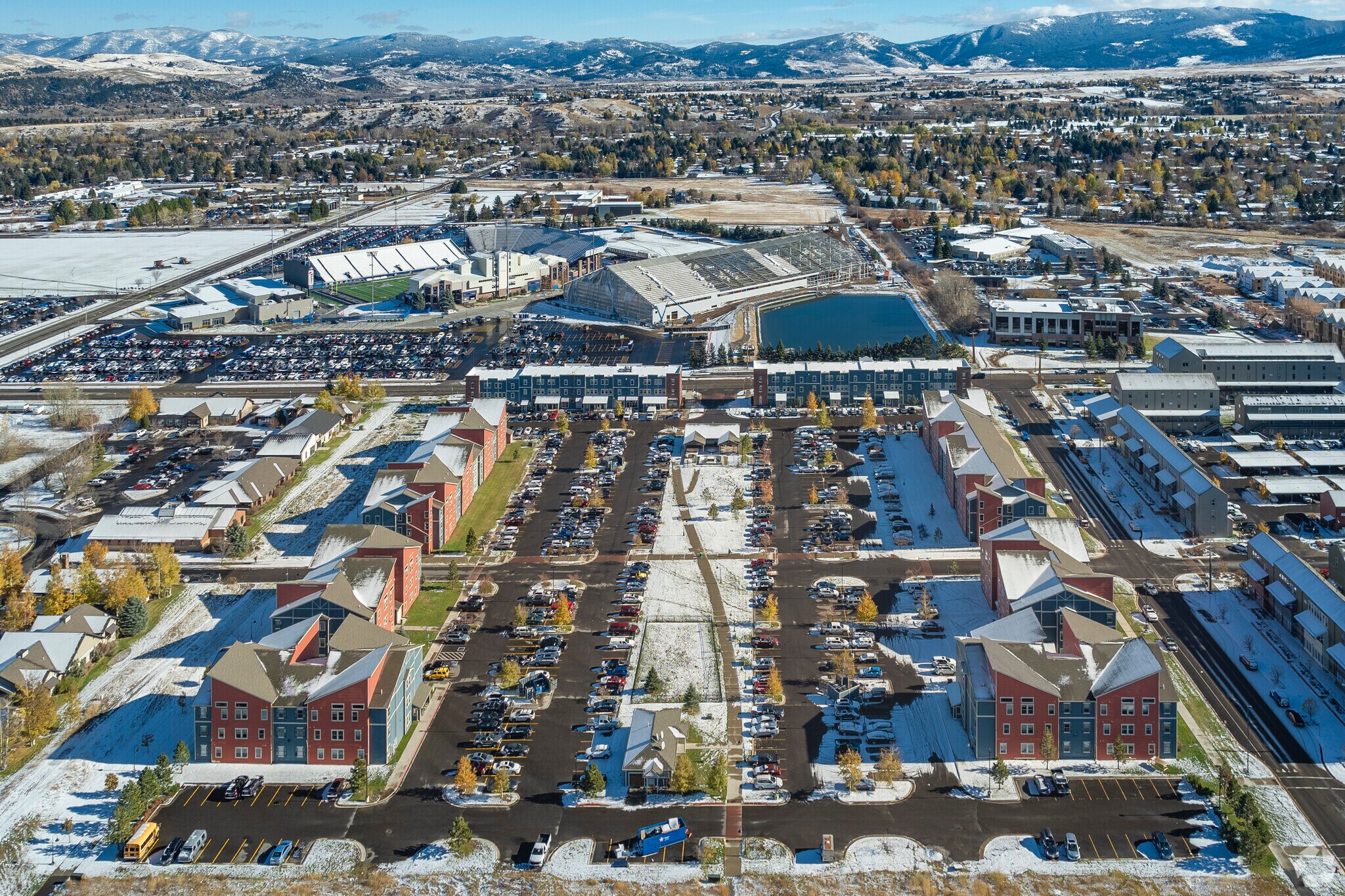 Wide panoramic shot of Bozeman Stadium View Apartments, showcasing off-campus apartments for rent near Montana State University in a vibrant community.